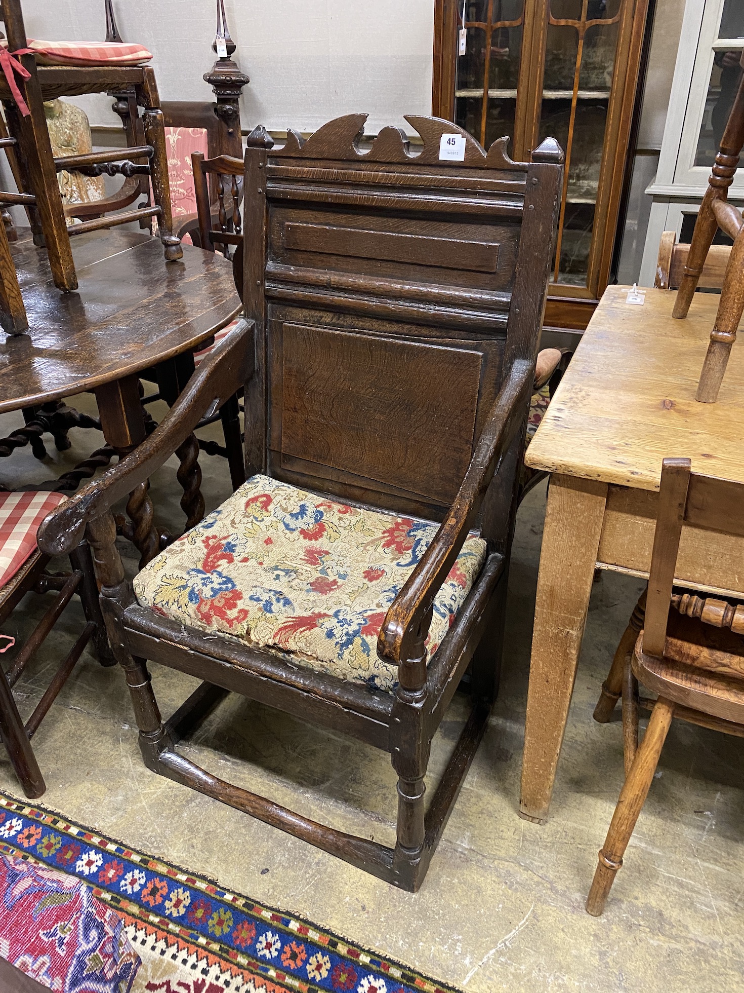 An oak Wainscot type chair (reduced in height), width 56cm, depth 55cm, height 110cm